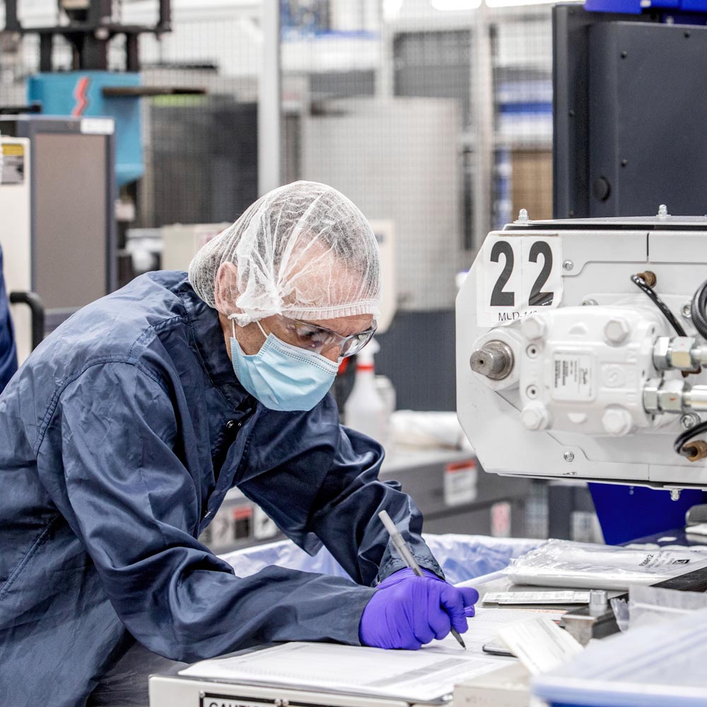 Man working in medical supply manufacturing facility