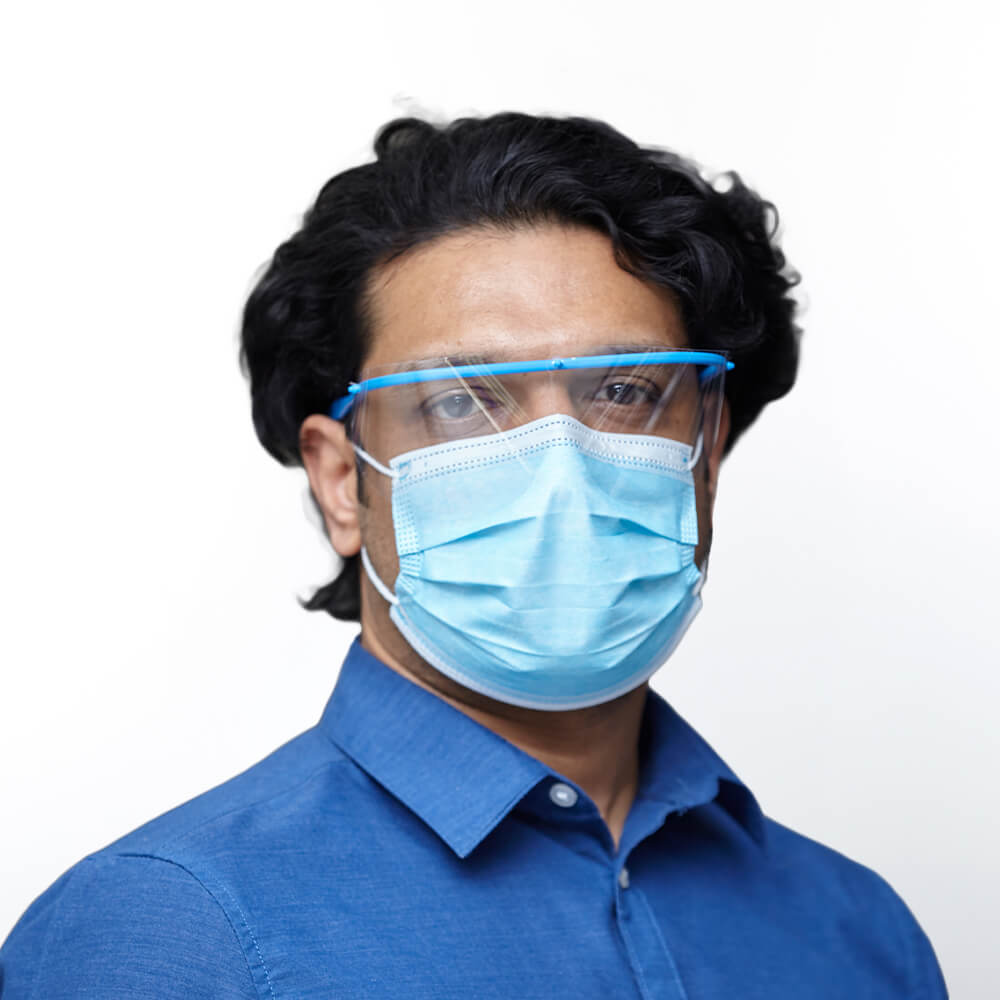 Female medical professional wearing face shield